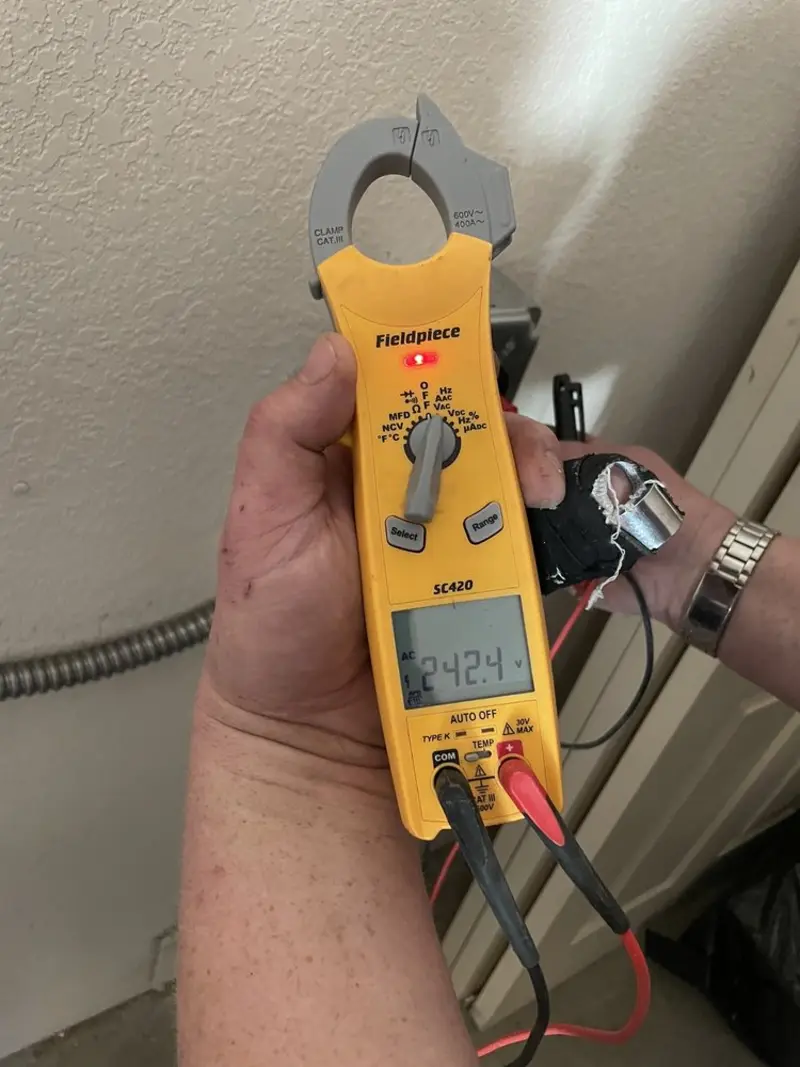 Voltage testing with clamp meter during Outlet Installation in Perkiomen
